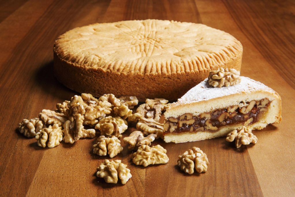 Engadiner Nusstorte (nut tart) is made from buttery pastry, creamy caramel and walnuts.