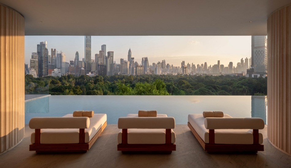 The hotel’s infinity swimming pool overlooks Lumphini Park and the Bangkok skyline.
