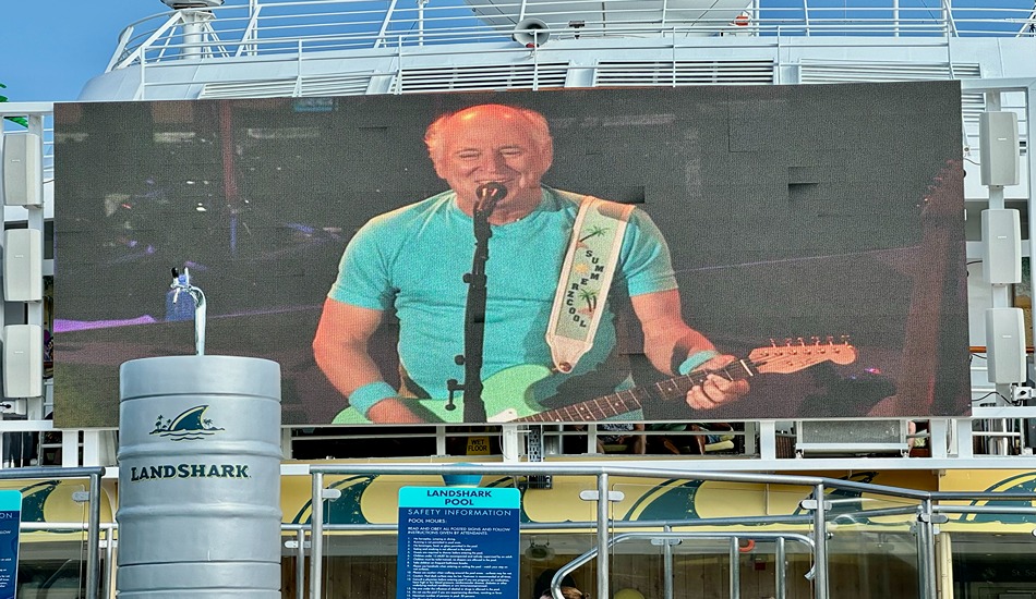 The Landshark Pool’s movie screen shows a 2016 concert given by Jimmy Buffett outside of Denver. (Randy Mink Photo) 