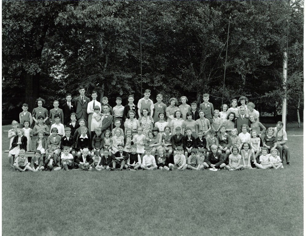 Children with H.W. Hoover Sr. on Aug. 27, 1940 at Hoover Camp (now called Hoover Park). HW Sr is standing, third row, second from right.