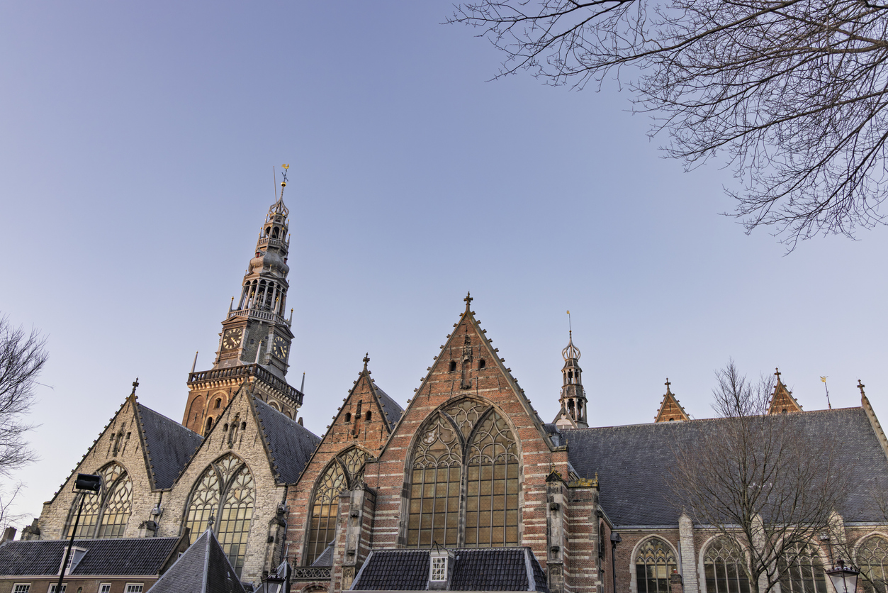 Gothic Architecture of De Oude Kerk Old Church in Amsterdam Under a Clear Sky. Gothic Architecture of De Oude Kerk Old Church in Amsterdam Under a Clear Sky.