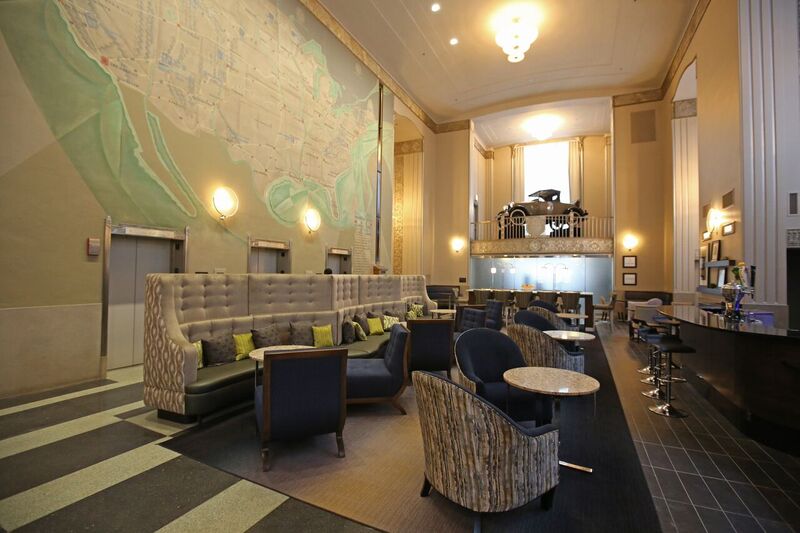 A vintage mural map of the United States, along with a 1928 Ford Model A, give the Hampton Inn lobby a yesteryear feel Lobby