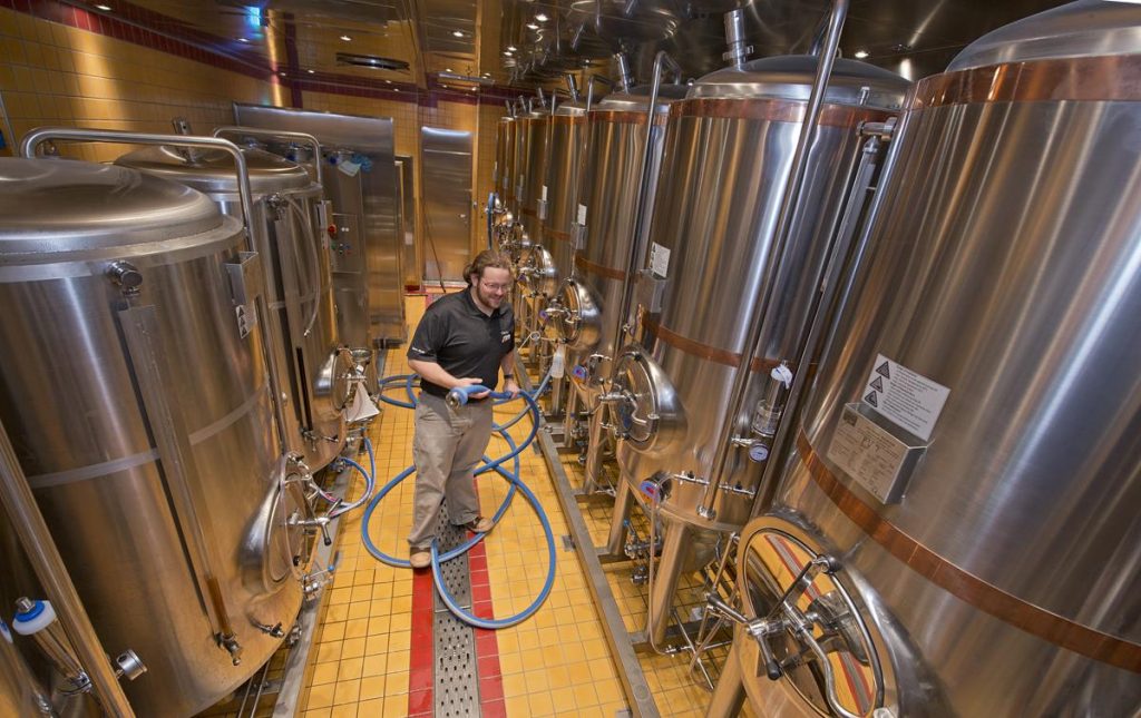 Carnival Vista Brewmaster Colin Presby Tends to the Fermentation Tanks for the Redfrog Pub and Brewery (photo courtesy of Carnival Cruise Line)