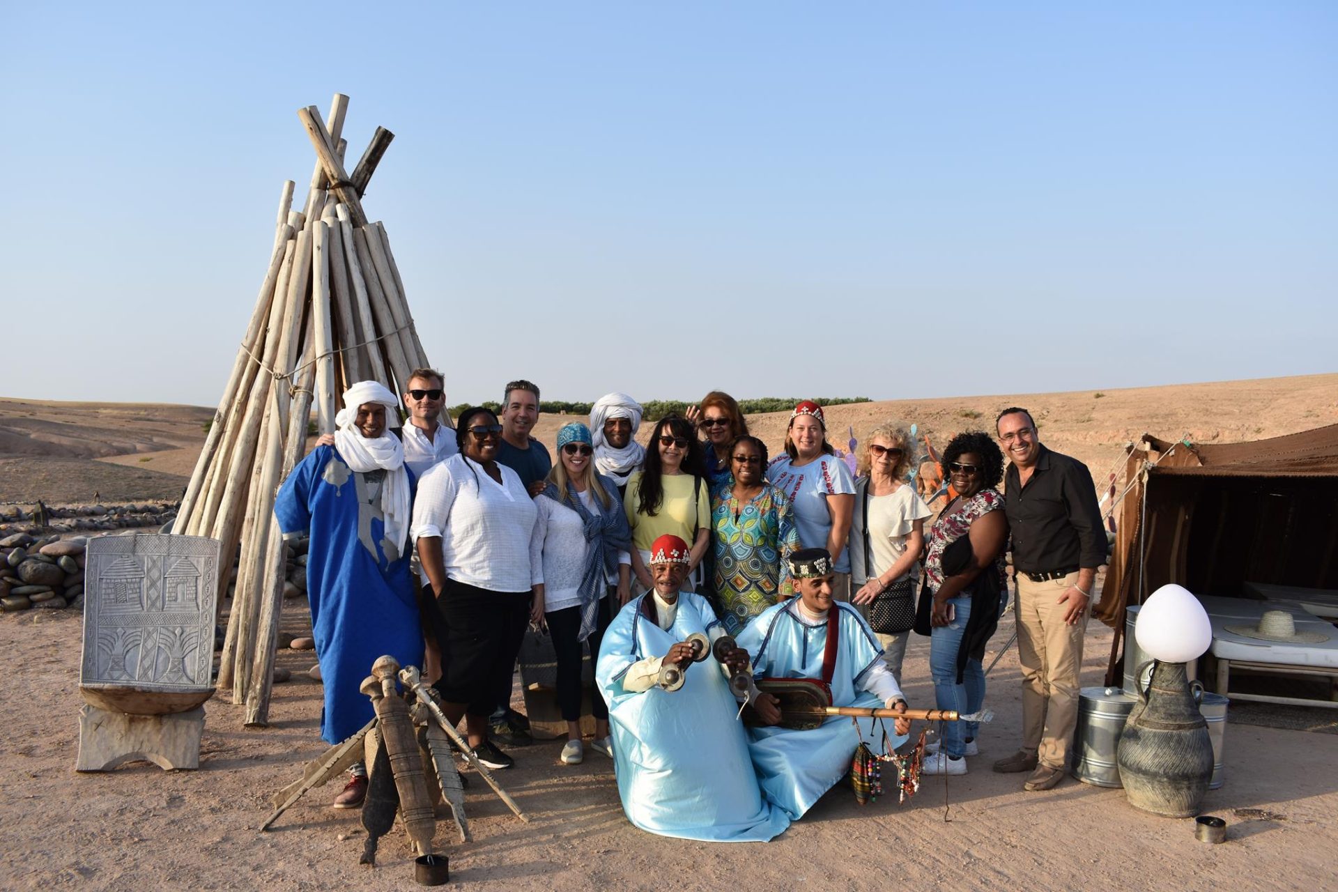 Members of tour group get a taste of local culture at Agafay Desert Luxury Camp outside of Marrakech.