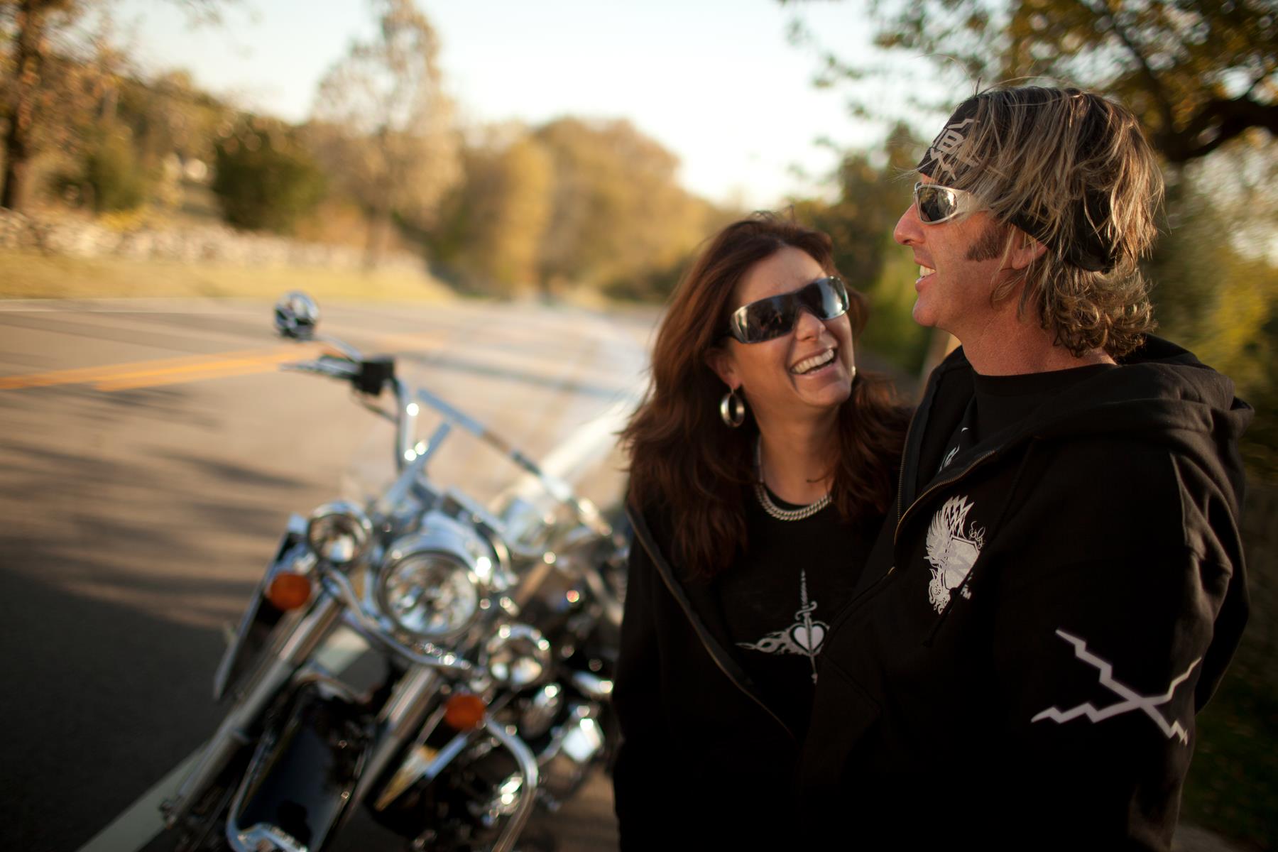 Couple posing near motorcycle TWisconsin
