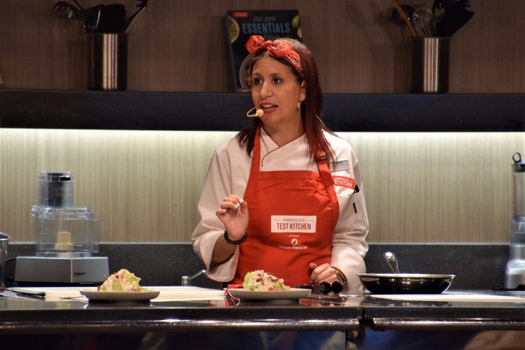 Guests learn to cook tasty dishes at America's Test Kitchen cooking classes on Holland America Line. 