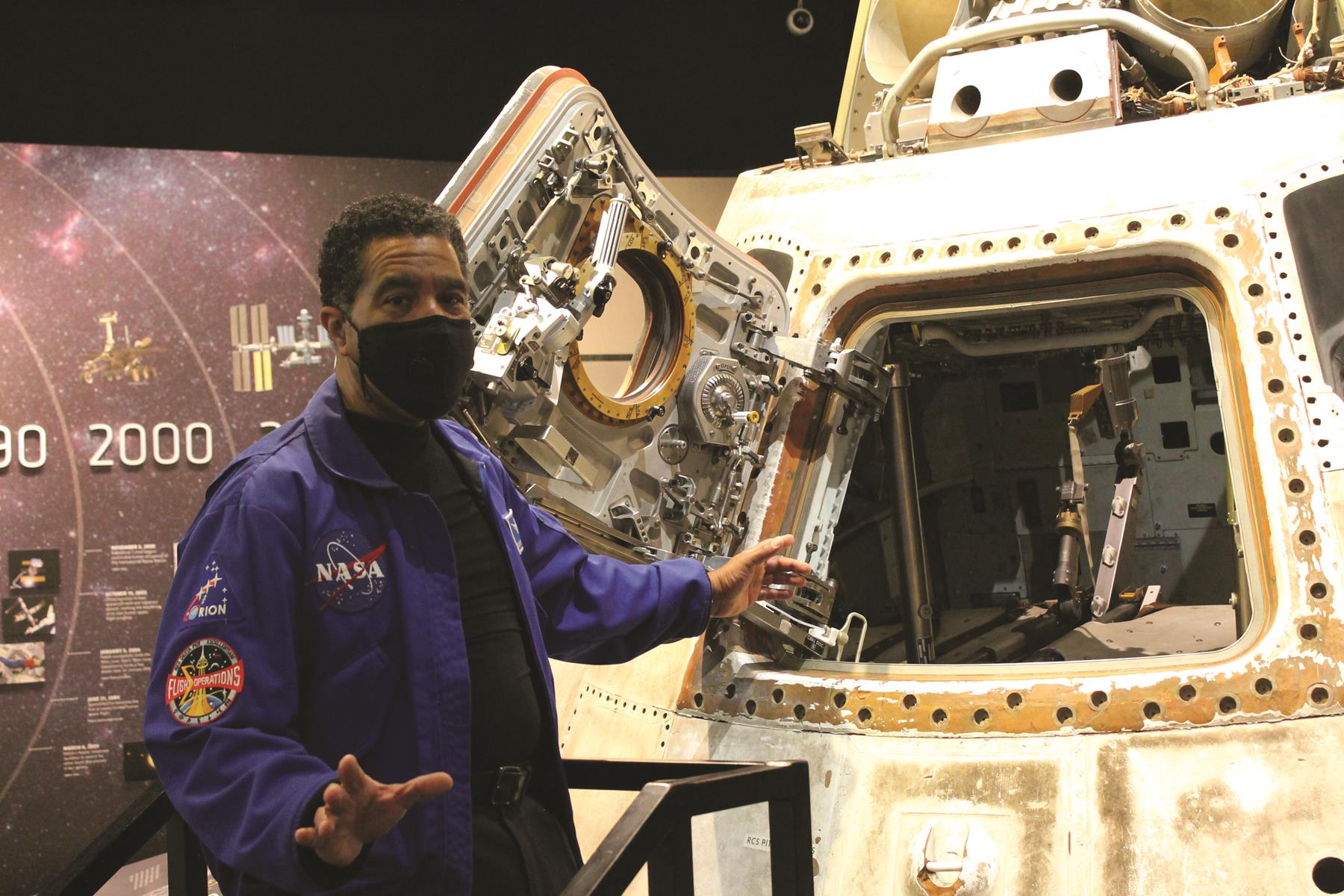 A STEM Learning staffer, JonDarr Bradshaw, conducts a “Capsule Chat” alongside the Apollo Command Module. Ohio aviation