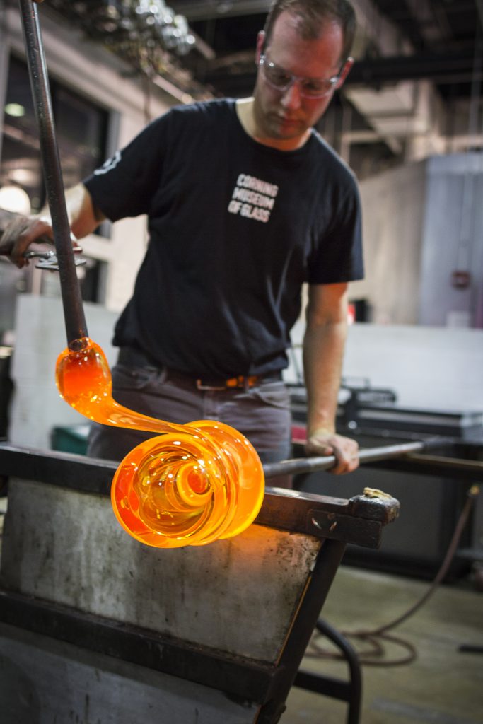 Eric Meek working hot glass for photo session for CMoG Billboard