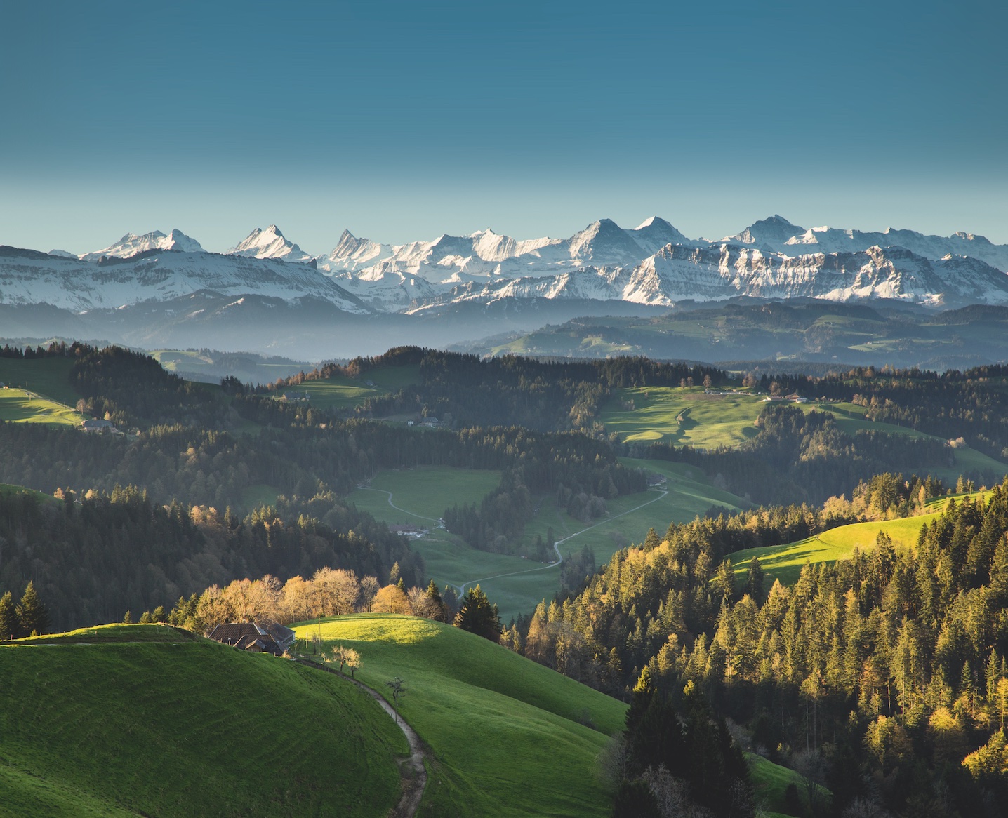 Forests, lush meadows and breathtaking views of the Bernese Alps and Jura mountains captivate travelers exploring the hilly Emmental Region. Switzerland Tourism/Jan Geerk