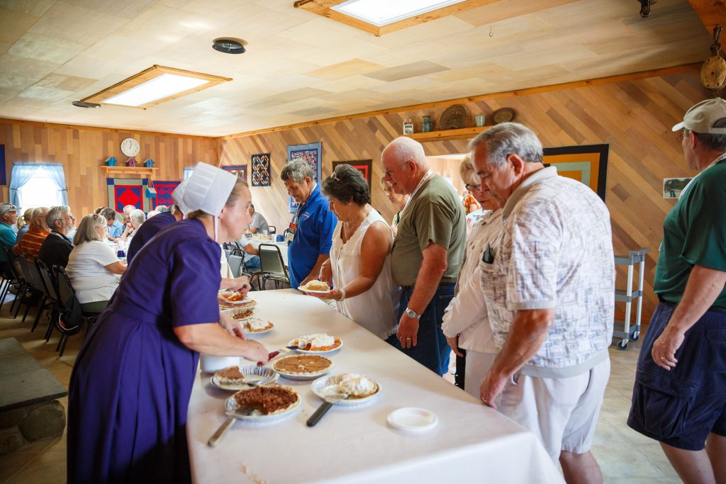 Feasting on scrumptious food at an Amish home in Elkhart County, Indiana. Photo courtesy of Elkhart County CVB