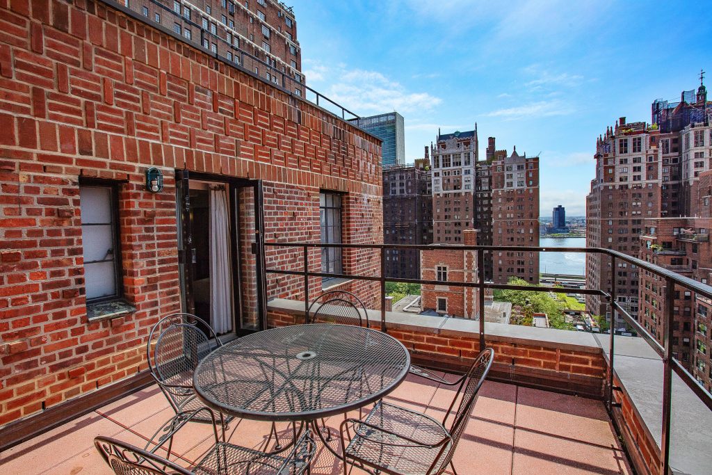 A handful of guest rooms offer balconies that afford views of Tudor City buildings and the East River. (Photo credit: Westgate Resorts)