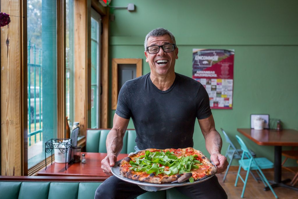 Tony Valinoti, owner of nationally acclaimed Deluca’s Pizzeria, serves up mouthwatering New York-style pizza. (Photo credit: Visit Hot Springs)