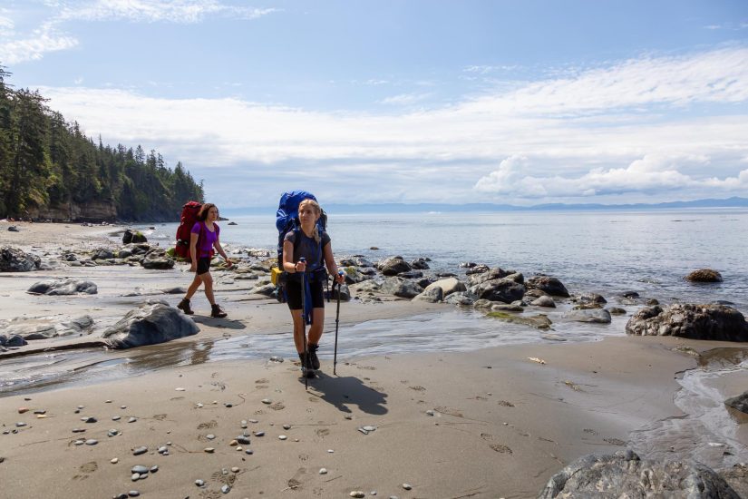  Beach Vacations for Relaxing Group Trips - beach hiking on the Juan de Fuca Trail on Mystic Beach in the Pacific Northwest Coast. Photo credit Freepik