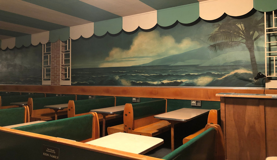 Murals and cabana-style awnings evoke a beach club atmosphere in the well-preserved booth seating area of the historic Surf Ballroom. (Randy Mink Photo)