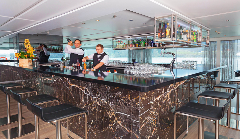 The bar and lounge is the Scenic Opal’s prime gathering spot. The all-inclusive cruise fare includes alcoholic drinks in the bar and dining room. (Photo credit: Gillies & Zaiser)