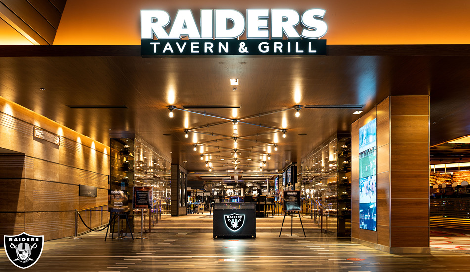 Football memorabilia accents Raiders Tavern & Grill.