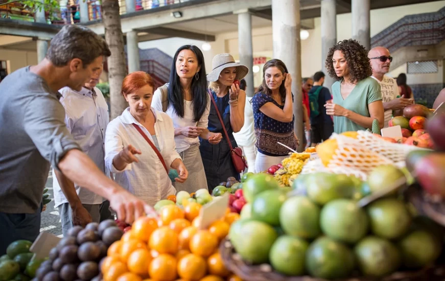 Travel group at a Market with Guide