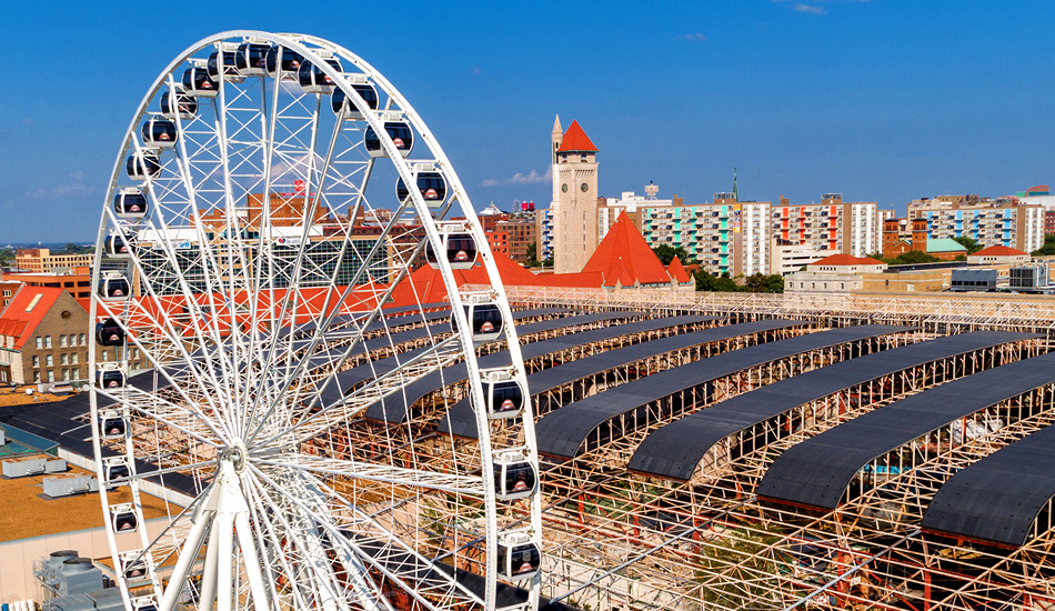 The St. Louis Wheel rises high above the historic train shed at St. Louis Union Station Hotel.