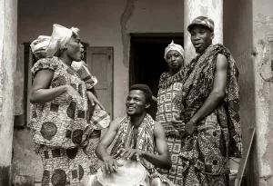 Grayscale Photo of People Wearing Traditional Clothes