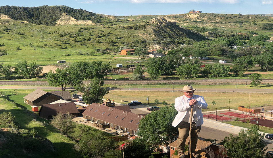 Joe Wiegand, as Teddy Roosevelt, leads a hike for tourists in Medora. (Randy Mink Photo)