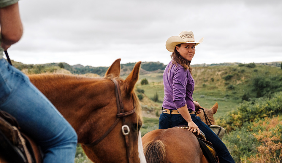 Trail rides explore the rugged landscapes surrounding Medora. (Photo credit: North Dakota Tourism)