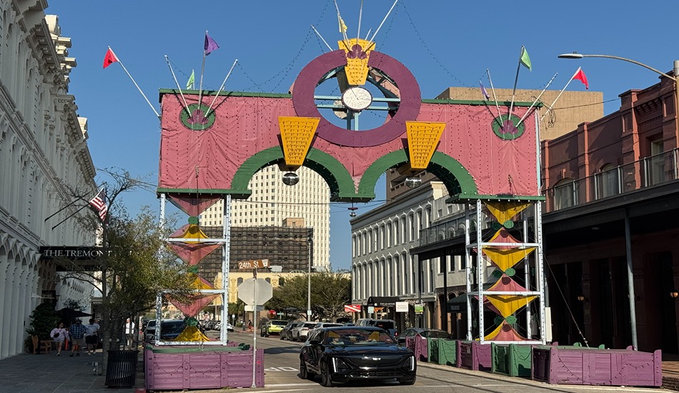 The Mardi Gras Arch adds a festive touch to Mechanic Street in Galveston’s Strand Historic District. 