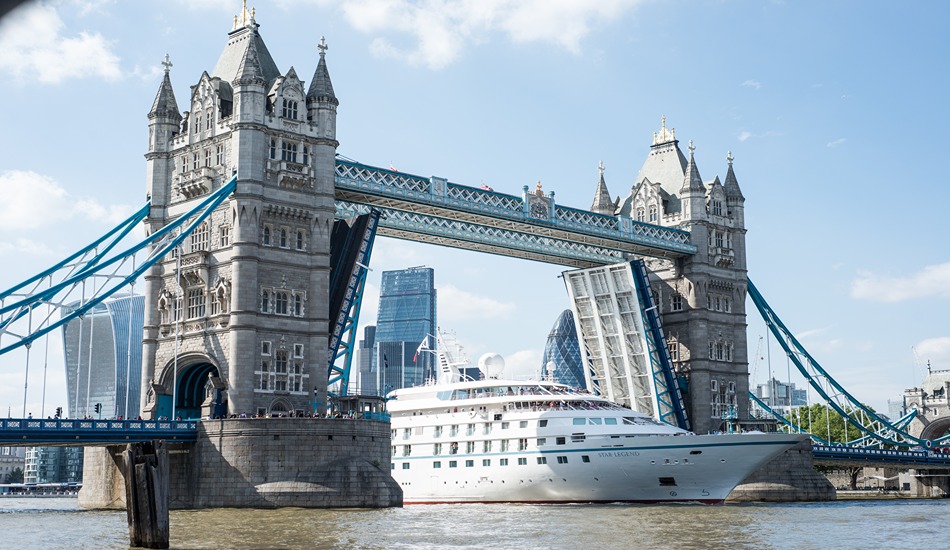 The Star Legend passes through Tower Bridge on the River Thames in London.